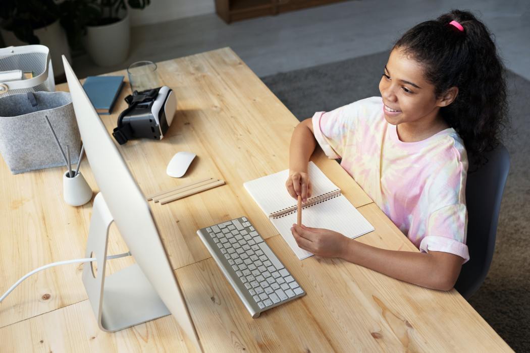 Young learner sitting in front of a computer